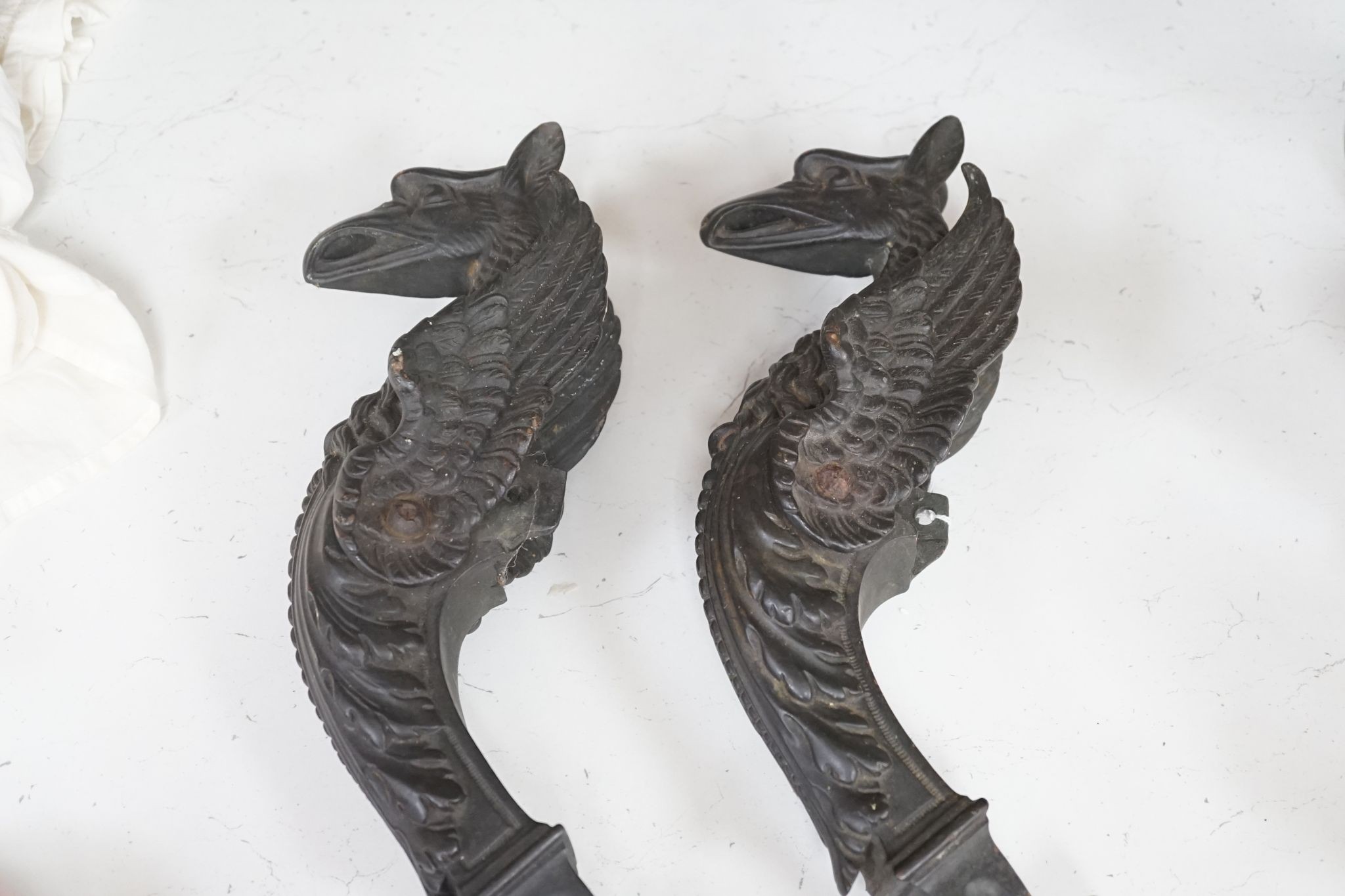 A pair of 19th century bronze griffin furniture mounts 62cm